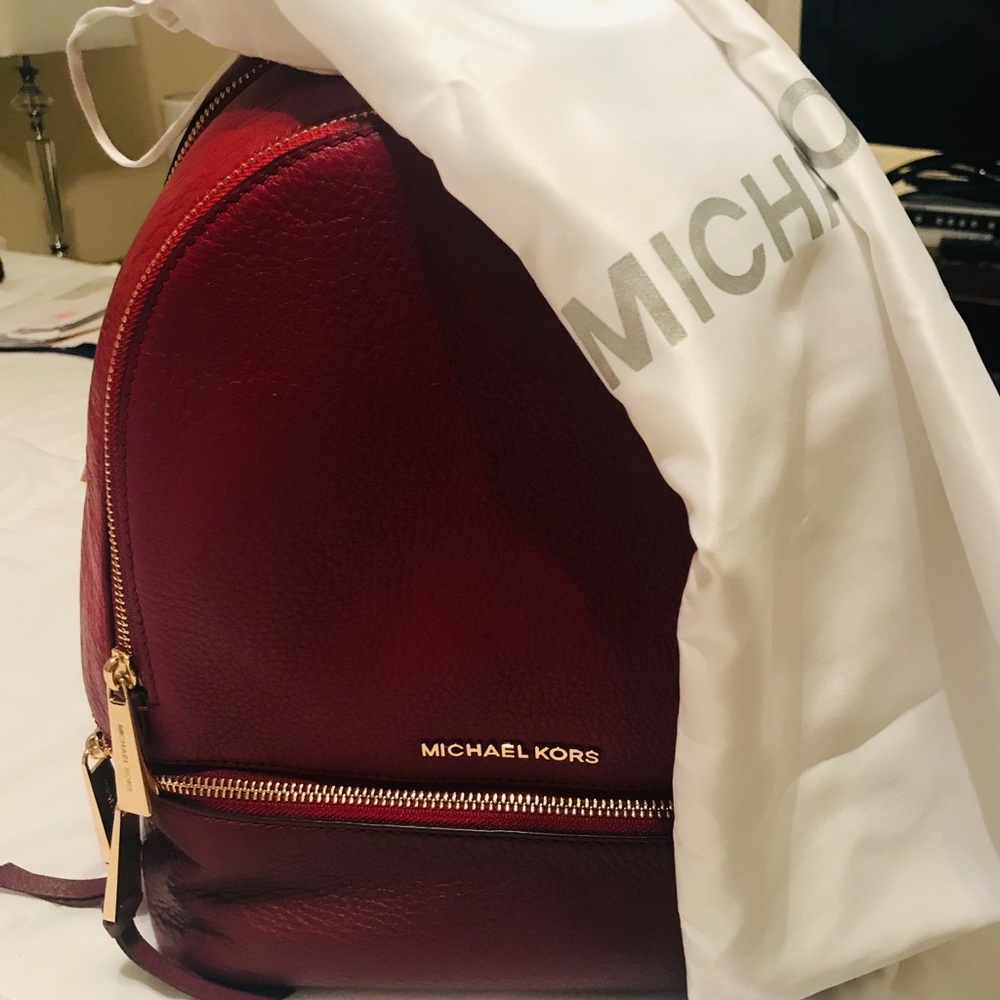 Micheal Kors backpack ( used once)